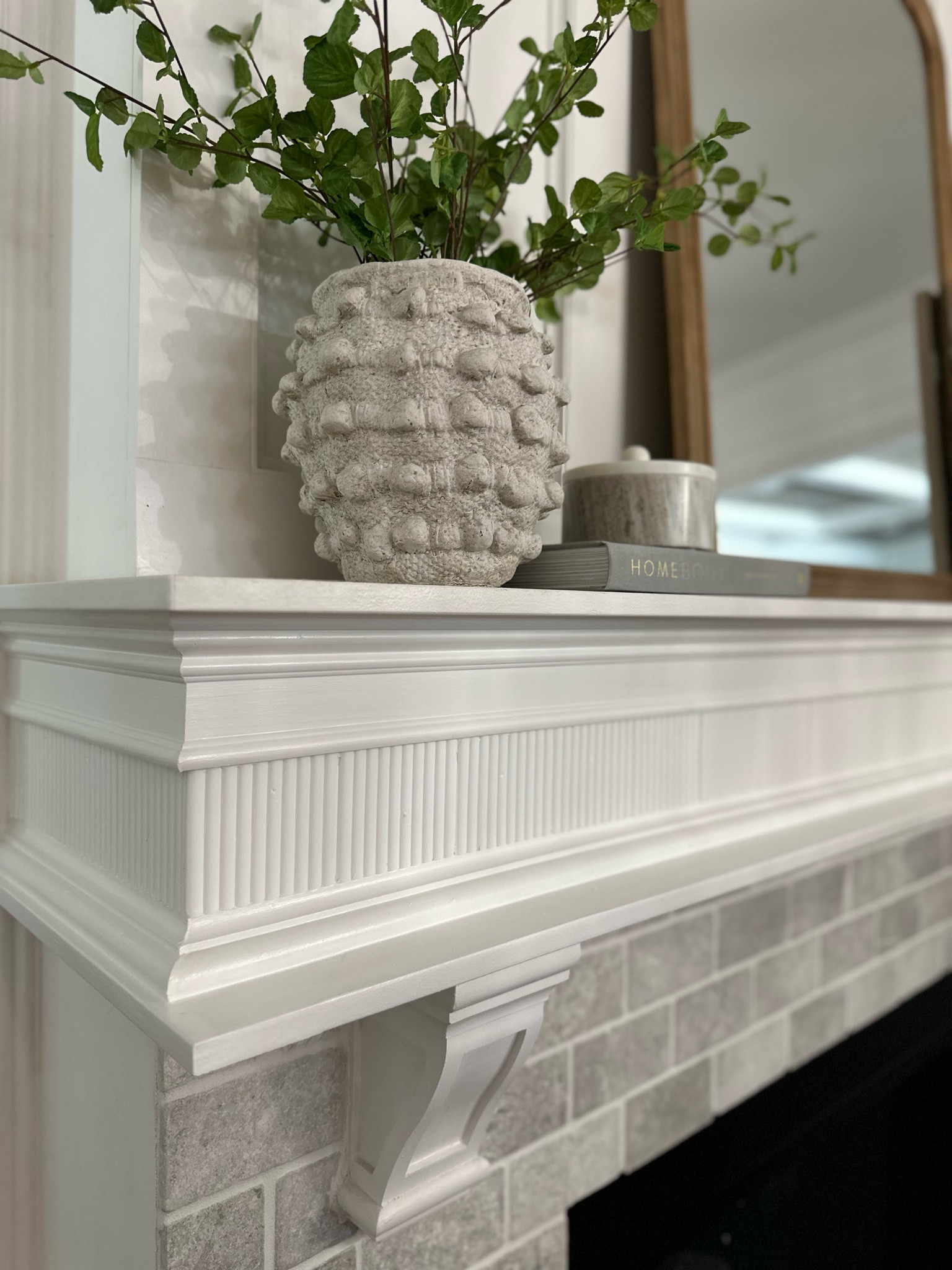 Anthropologie Minka textured viral pot vase and marble trinket dish from studio McGee at target with Lowe’s fluted reeded pole wrap style trim work diy on white mantel.

#LTKStyleTip #LTKFindsUnder50 #LTKHome
