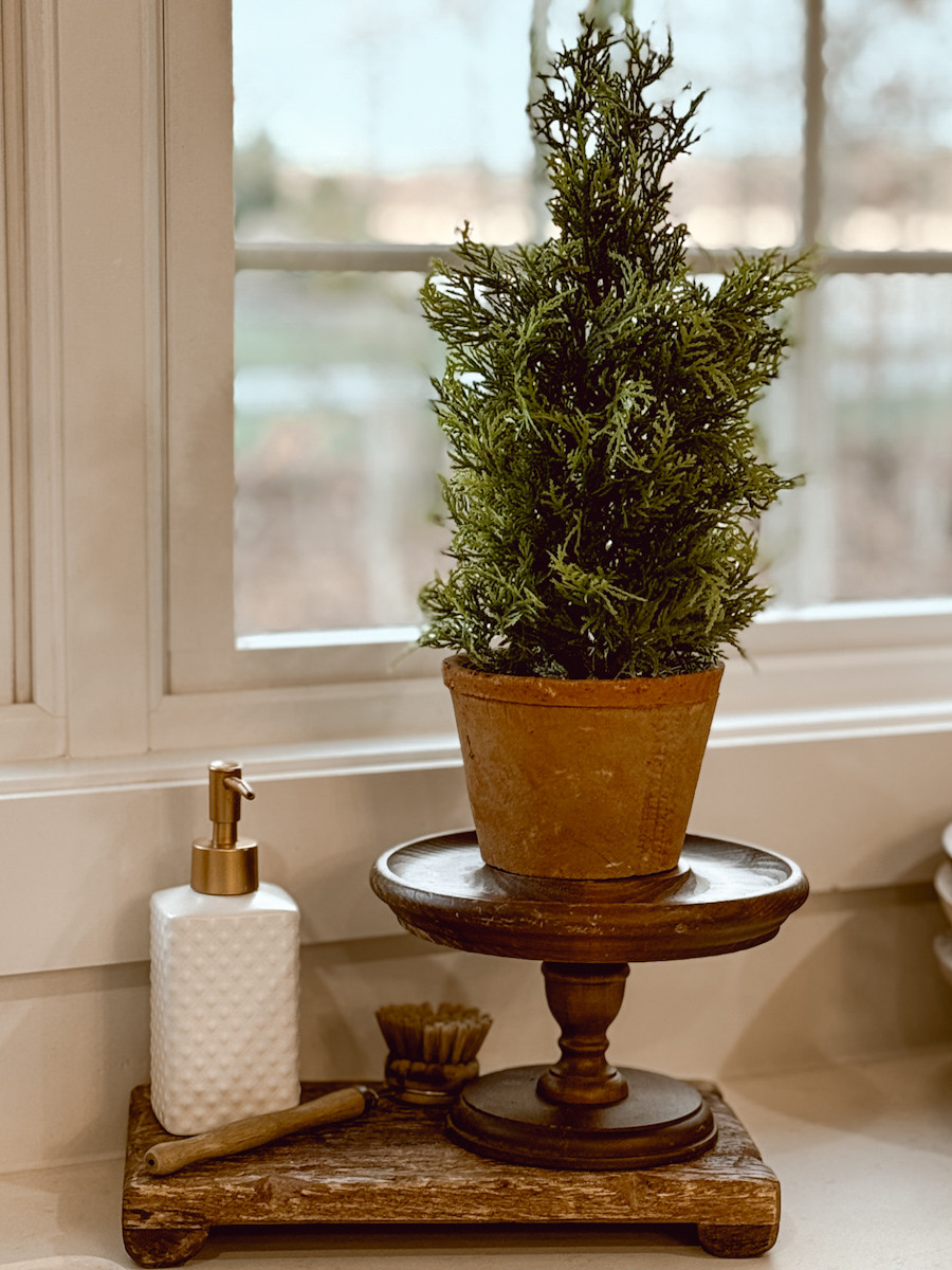 I love this small faux Winter tree from McGee & Co. It is incredibly realistic and adds a soft Winter green to our kitchen space. They are also currently on sale for Black Friday.  

 #LTKCyberWeek #LTKHome #LTKSaleAlert