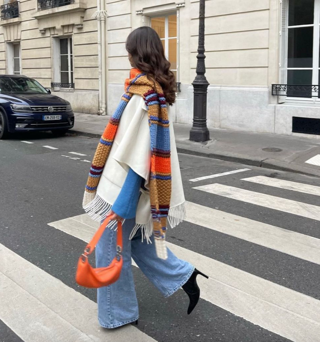 Parisian street style outfit, wide leg jeans outfit, chic fall layering outfit, colorful scarf outfit, elevated casual style.
A simple outfit formula that instantly looks stylish: wide-leg jeans, a structured coat, and a bold oversized scarf for color. The orange bag adds the perfect pop, making this an easy elevated everyday outfit for coffee runs, travel days, or city walks. 

 #LTKootd