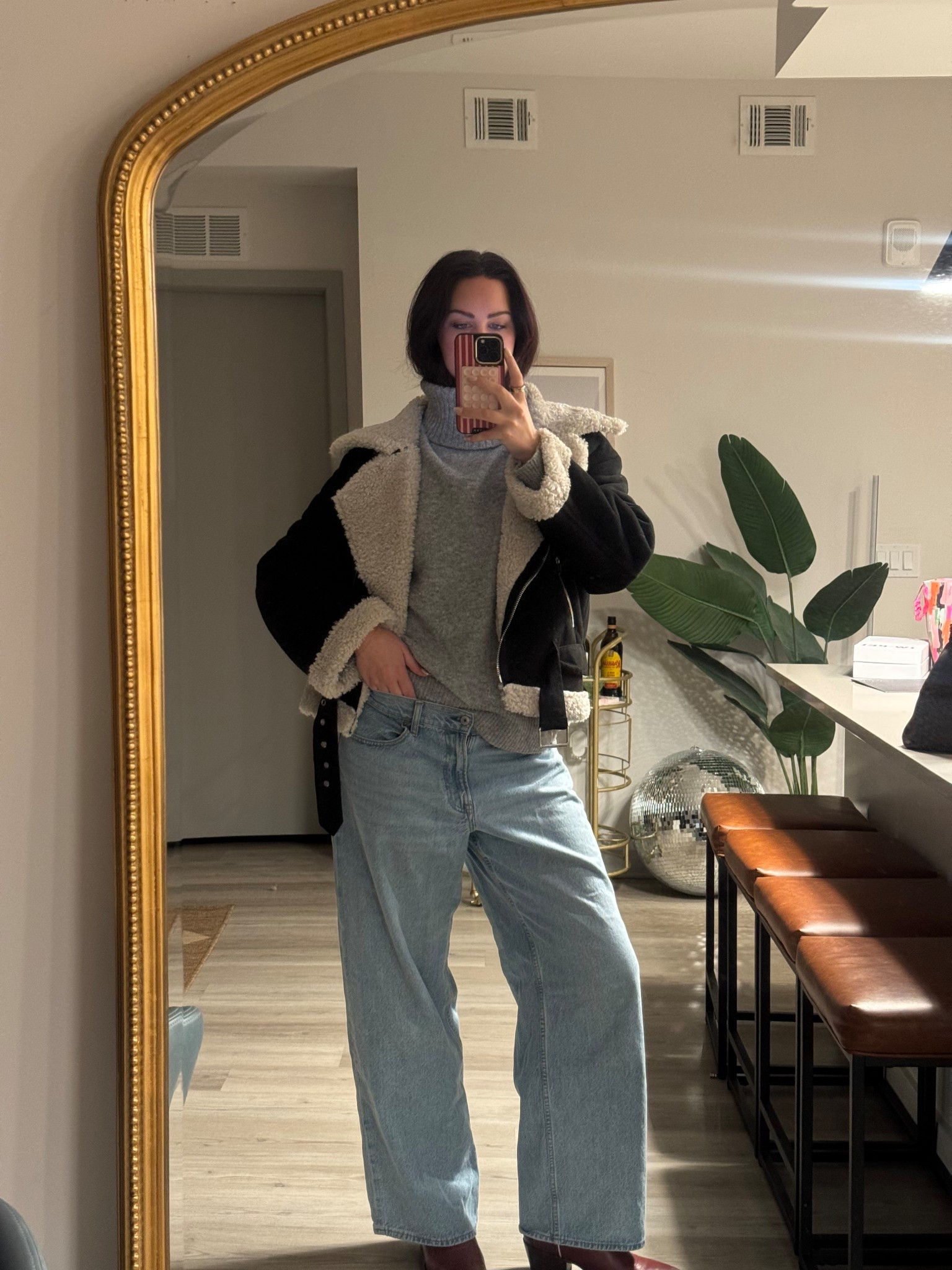 Nashville outfit | going out for date night at a local wine bar | gray turtleneck sweater loose baggy low rise light wash jeans black winter boots black sherpa jacket western inspired 

#LTKootd #LTKSeasonal #LTKTall