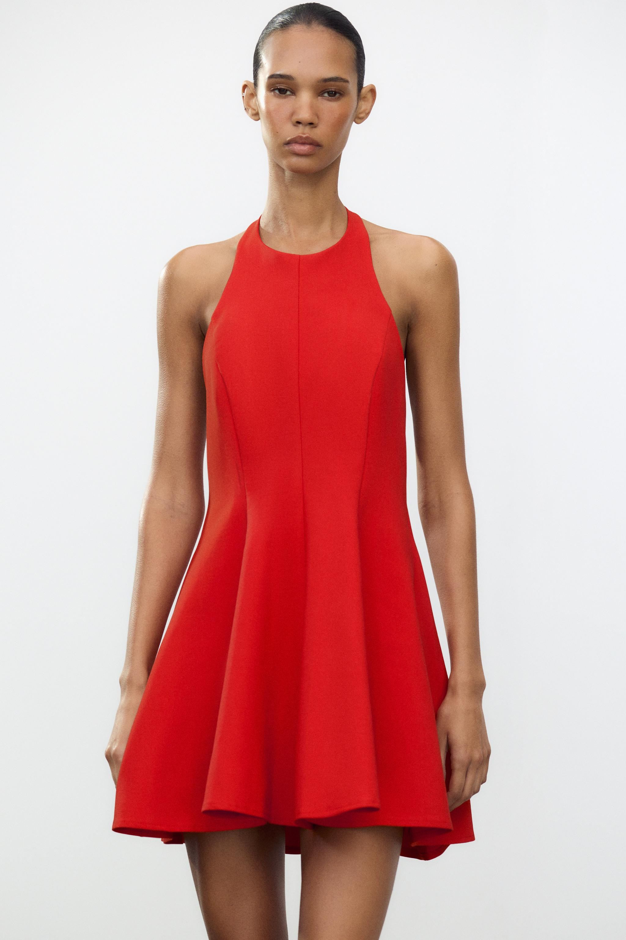 Short halter neck dress. Open back. Hidden in-seam side pockets. Matching inner lining. Back clos... | Zara US