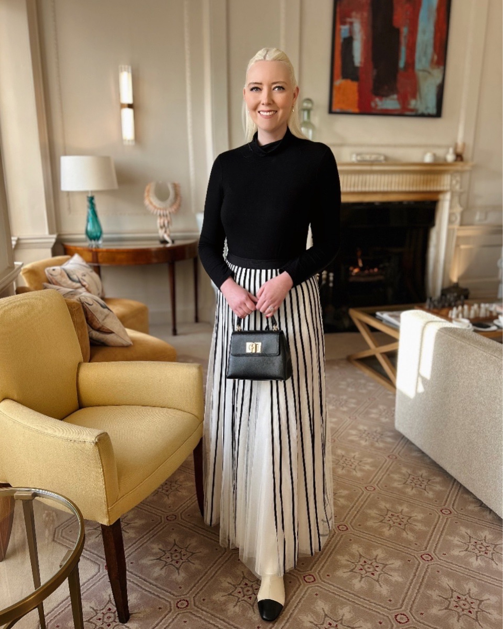 Monochrome is bold and chic, but also romantic! Partnering the Hobbs Mischa roll neck in black with an ivory and black tulle stripe maxi skirt, my timeless Furla 1927 Mini top handle bag and the most beautiful two tone cream / black ankle boots by Rixo. Finally, a pair of pearl drops by LK Bennett offers the finishing touch.#LTKdatenight 

#LTKuk #LTKeurope