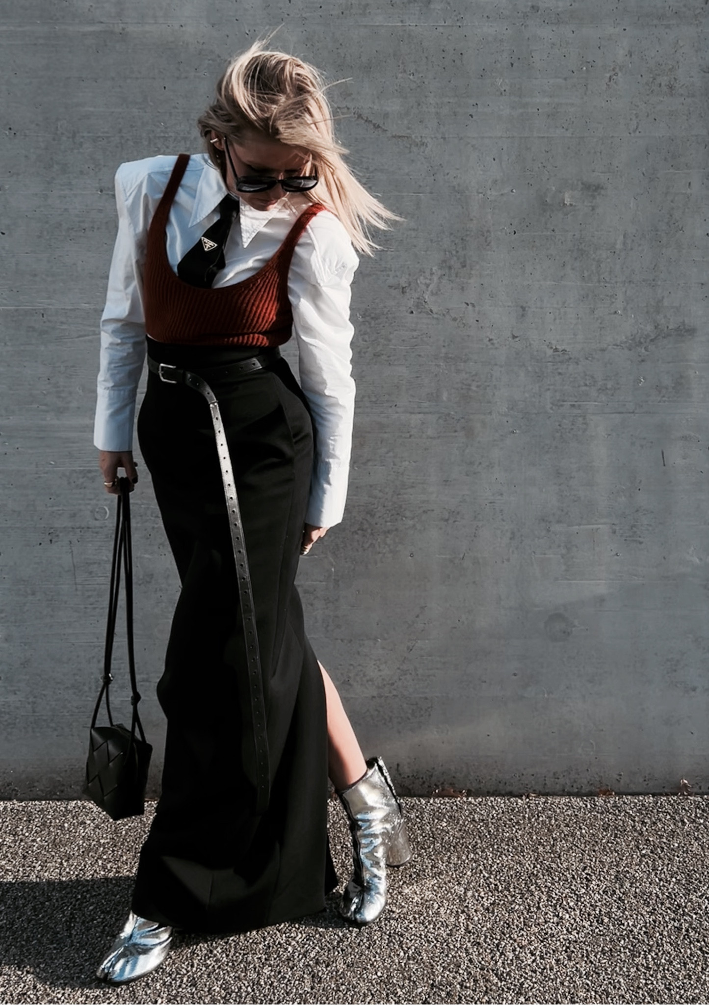 The first outfit of 2024 🖤

Embrace the power of contrast. In the symphony of black and white, I wear confidence stitched by Saint Laurent's black maxi skirt, harmonized with a super long waist belt. The white padded shoulder shirt is a canvas of strength, paired with a Prada re-nylon tie, symbolizing resilience. The Bottega Veneta mini cassette bag and silver Tabi boots are my notes of sophistication.

This ensemble isn't just an outfit, it's a melody of self-expression. Unleash your bold elegance, tell your story, and let the world be your runway. 🖤



#LTKeurope #LTKshoecrush #LTKstyletip