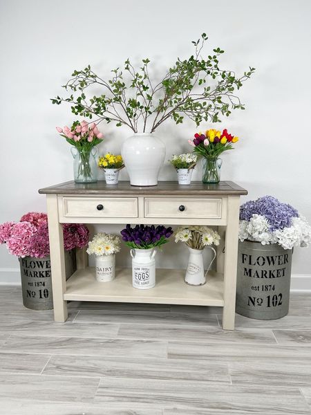 Console table surrounded by faux flowers. Spring is in the air! #home #amazon #amazonhome #founditonamazon #springdecor #flowers #fauxflowers #vase #vases #flowervase #flowervases #stems #fauxstems 

#LTKhome