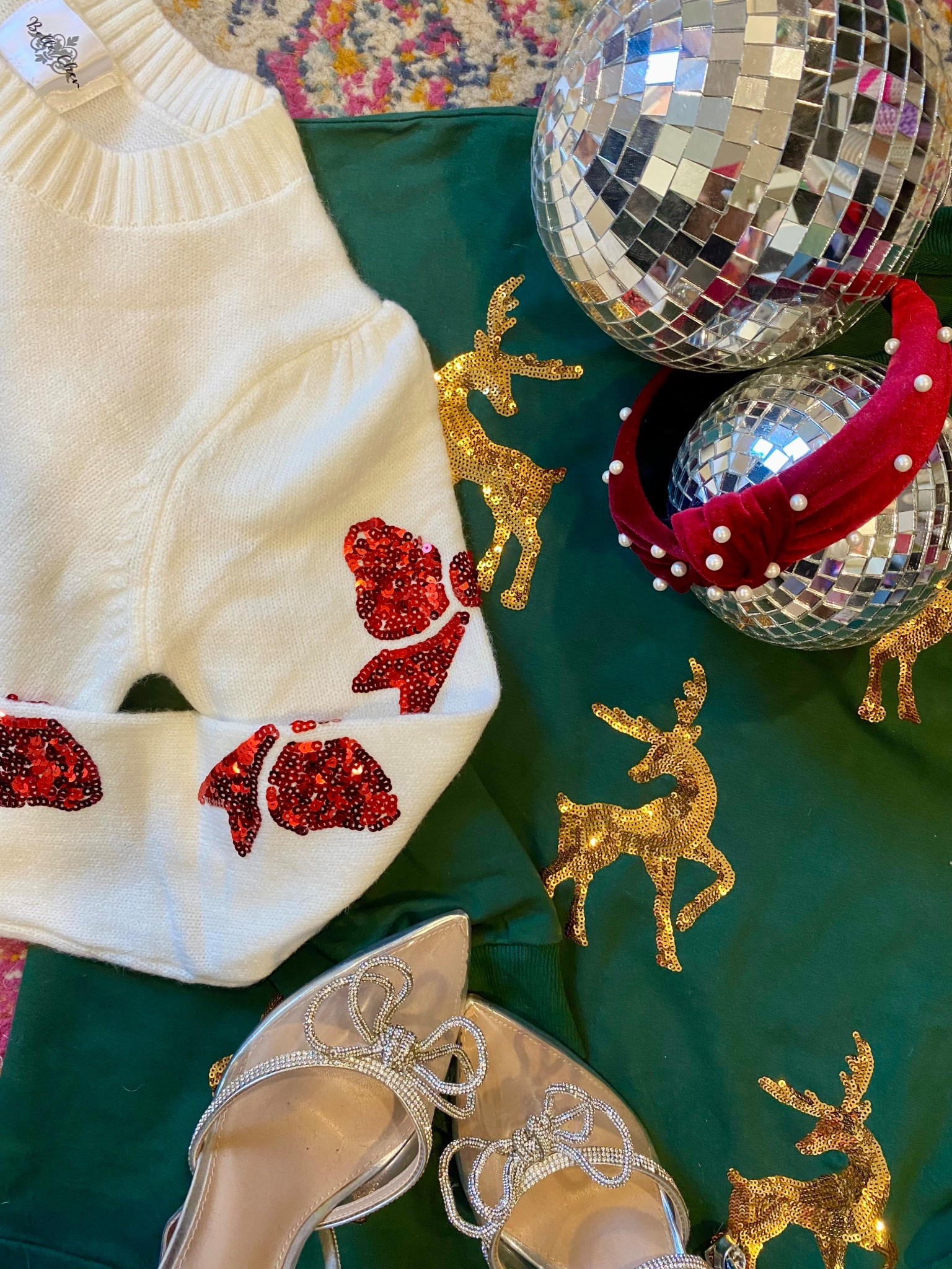 Cutest festive sweater haul! These all bring a pop of color and sparkle to the holidays. 🎄✨ I went with a size M in the green reindeer sweater for an oversized fit and loved the length. It’s a little more of a sweatshirt material, which was super cozy. Rounded up the haul here! 

#LTKHoliday #LTKgrwm #LTKootd