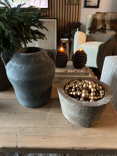 Amazon finds. Beautiful home decor. Christmas garland, pine cone flameless candle, concrete bowl, vase, coffee table books

#LTKsalealert #LTKhome