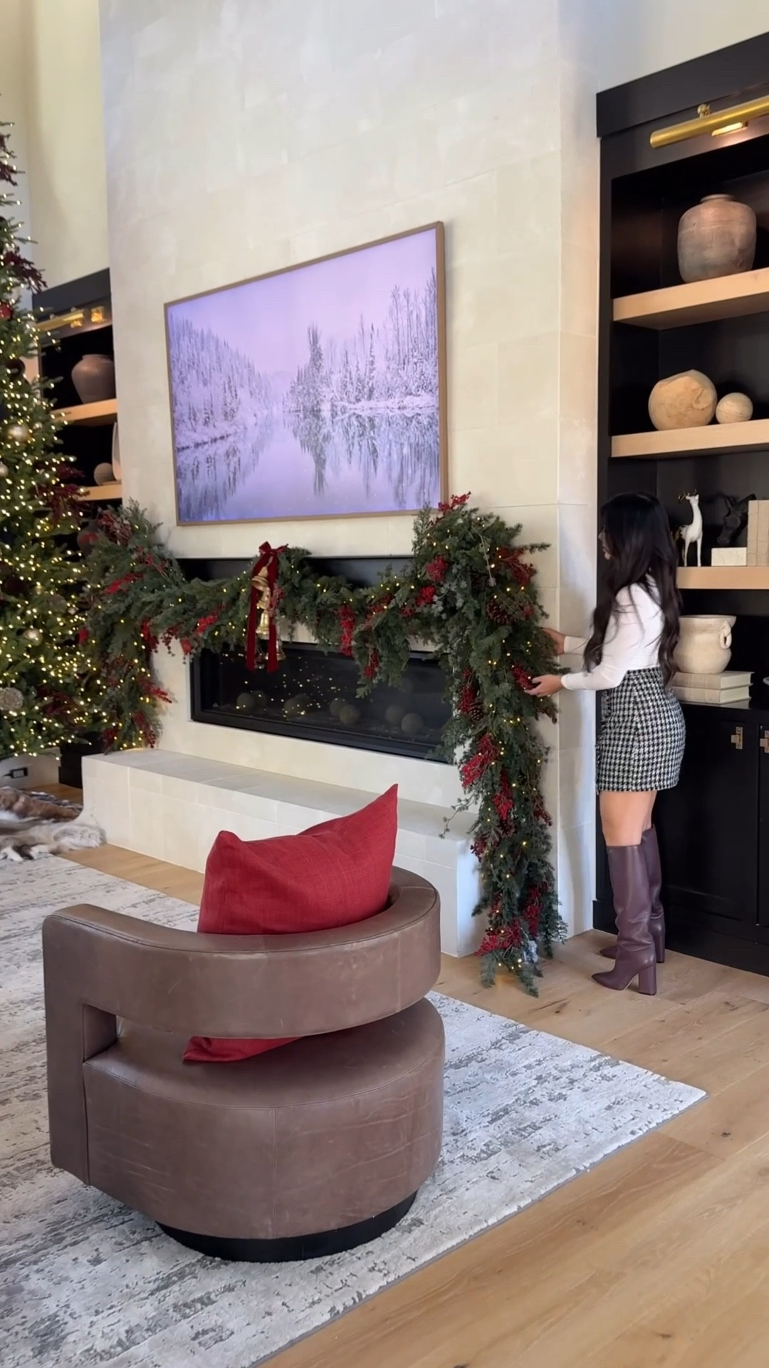 The great room and entry for Christmas! I used 4 of these 10’ garlands! I used magnetic hooks on the mantle. Furniture is RH cloud couch, Drew Swivels in Berkshire Truffle and the unsealed marble plinthe coffee table. Tree is a 15’ Home Depot tree and I love!!! My boots are Paris Texas and are straight from Italy. Took forever. Entry table is sold out from McGee and Co and penguins are from Arhaus last season. 

#LTKSeasonal #LTKHoliday #LTKHome