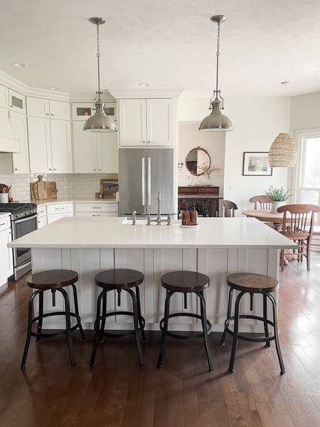 Our kitchen is white and bright with budget finishes.  You can have a beautiful kitchen on a budget!  

Kitchen industrial pendant lights.  Kitchen whirlpool appliances.  Kitchen wooden industrial bar stools.  Kitchen fire clay 33” farmhouse sink.  Satin nickel bridge kitchen faucet.  Amazon kitchen brushed nickel hardware.   

#LTKxTarget #LTKhome #LTKfamily