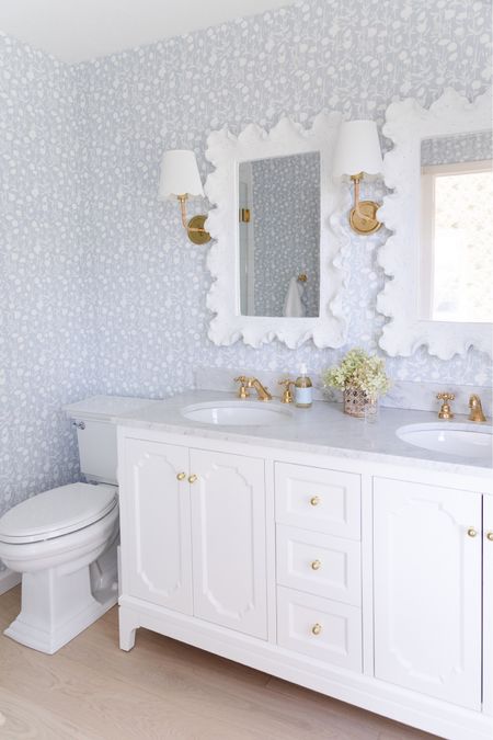 Lake cottage, white and blue bathroom, decor, white vanity, wave mirror, Amazon, toilet, brass fixtures, sconces, Serena and Lily, wallpaper, coastal, vacation vibes, decor inspo, home design inspiration

#LTKhome #LTKstyletip