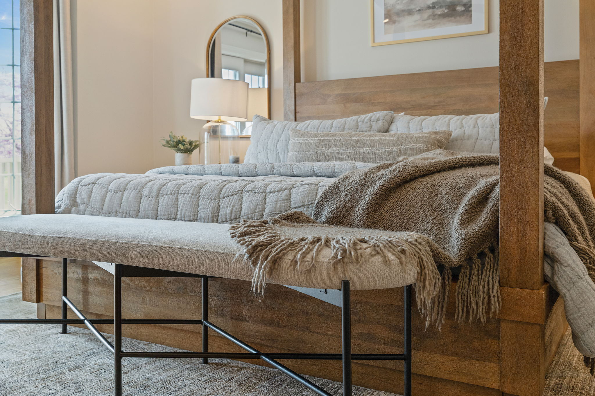 Primary bedroom makeover - This Pottery Barn furniture was the star of the show, but layers of neutral texture give the otherwise neutral bedroom so much character. Wood balanced with black metal, mirrors behind the glass table lamps to bounce light, a bench for practicality, and altogether, so much style.  

 #LTKHome