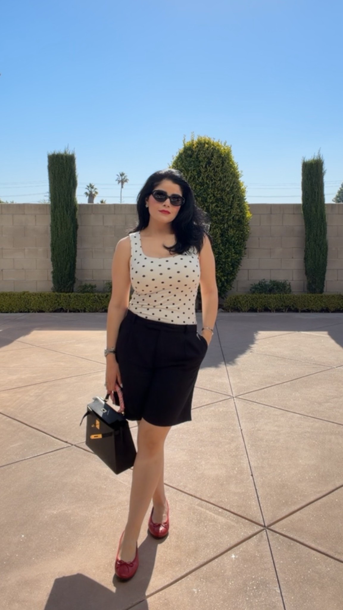 Polka dot top
Black Bermuda shorts red flats

#LTKootd #LTKgrwm #LTKMothersDay