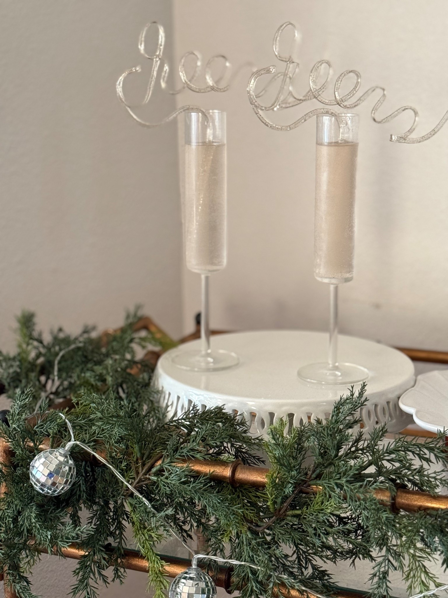 New Year’s Eve party hosting must haves. New Year’s Eve entertaining essentials. Champagne flutes. Glass champagne flutes. Cheers straws. These cheers straws are also perfect for a bachelorette party, a birthday party, a graduation party (many people graduate from college in the winter, myself included!), an engagement party and more! Disco ball garland! This disco ball garland looks great adorned with a holiday garland or faux cedar garland that’s perfect for winter too!! This bar cart is ideal! You can also use a console table! There are countless options! ❤️🎉🪩

#LTKHoliday #LTKFindsUnder50 #LTKSeasonal
