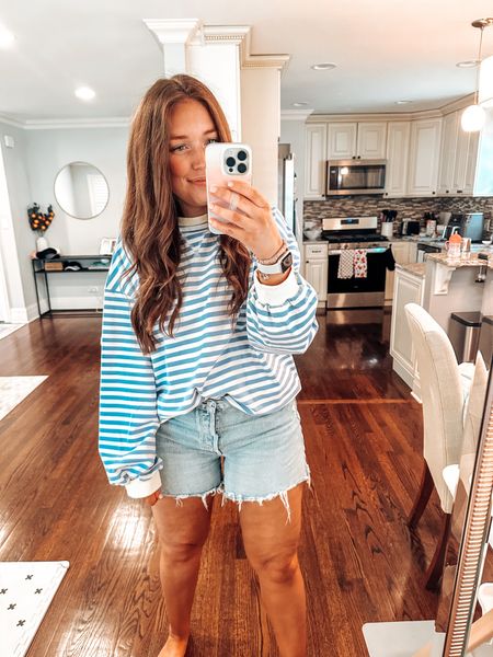 Wearing size XL. Runs more tts than oversized. Size up 1 if you want a more oversized fit. Comes in a bunch of colors. Very similar to a more expensive sweatshirt. 

Sweatshirt / spring outfit / summer outfit / stripes / striped sweater / coastal grandma / midsize 

#LTKfindsunder50 #LTKmidsize