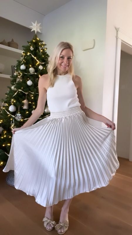 THE cutest party outfit for your next holiday party! Love the winter white look and this pleated skirt is everything! @shop.confete

#partyoutfit #nyeoutfit #winterwhiteoutfit #pleatedskirt

#LTKHoliday #LTKparties #LTKover40