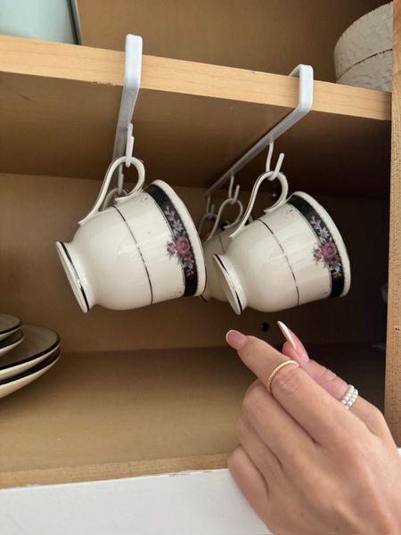 Hi beautiful!!!😊✨ Free up your cabinet space with these genius Cup Hooks! No tools needed, just slide them on and enjoy a clutter-free kitchen. Perfect for your coffee cups! Follow me @tiffanyallison7 for more smart solutions! 🥰💖 #amazon #amazonfavorites #kitchenorganization #cuphooks #amazondeals #storagesolutions #coffeevibes

