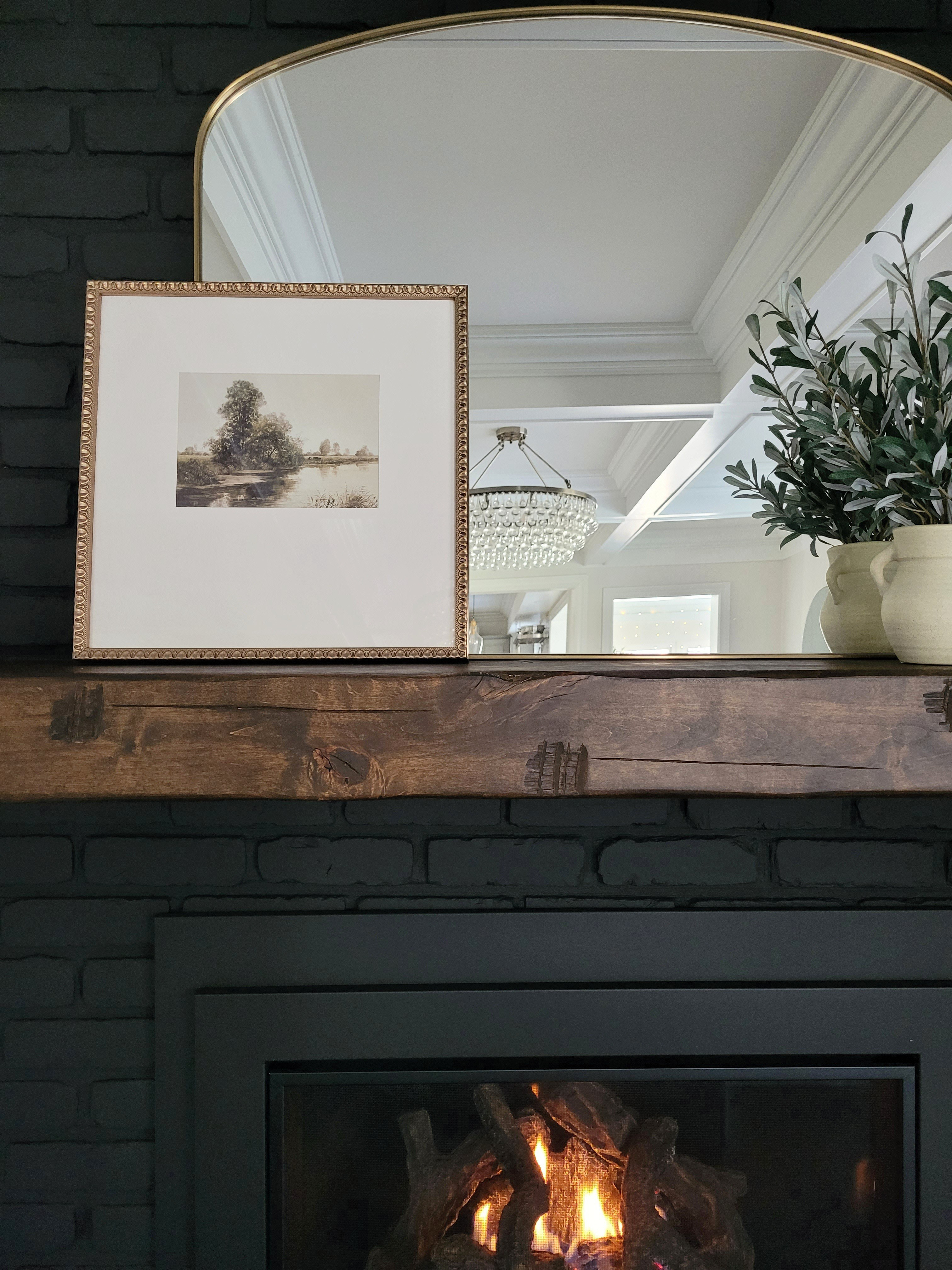 Black fireplace mantle styling with vintage inspired landscape art that's under $30 - perfect for transitioning to spring decor after the holidays!

#LTKStyleTip #LTKFindsUnder50 #LTKHome