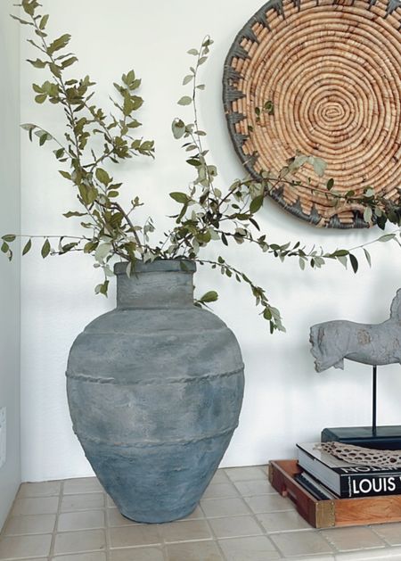 Fresh cut branches in the house this weekend. 

#ltkhome #vase #homedecor #entryway #urn #stonewarevase 
