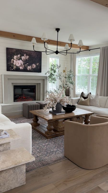Fireplace insert, coffee table, rug, accent chairs, sofa, curtains, chandelier, vase, bowl, pillow, cabinet

#LTKHome #LTKStyleTip #LTKVideo