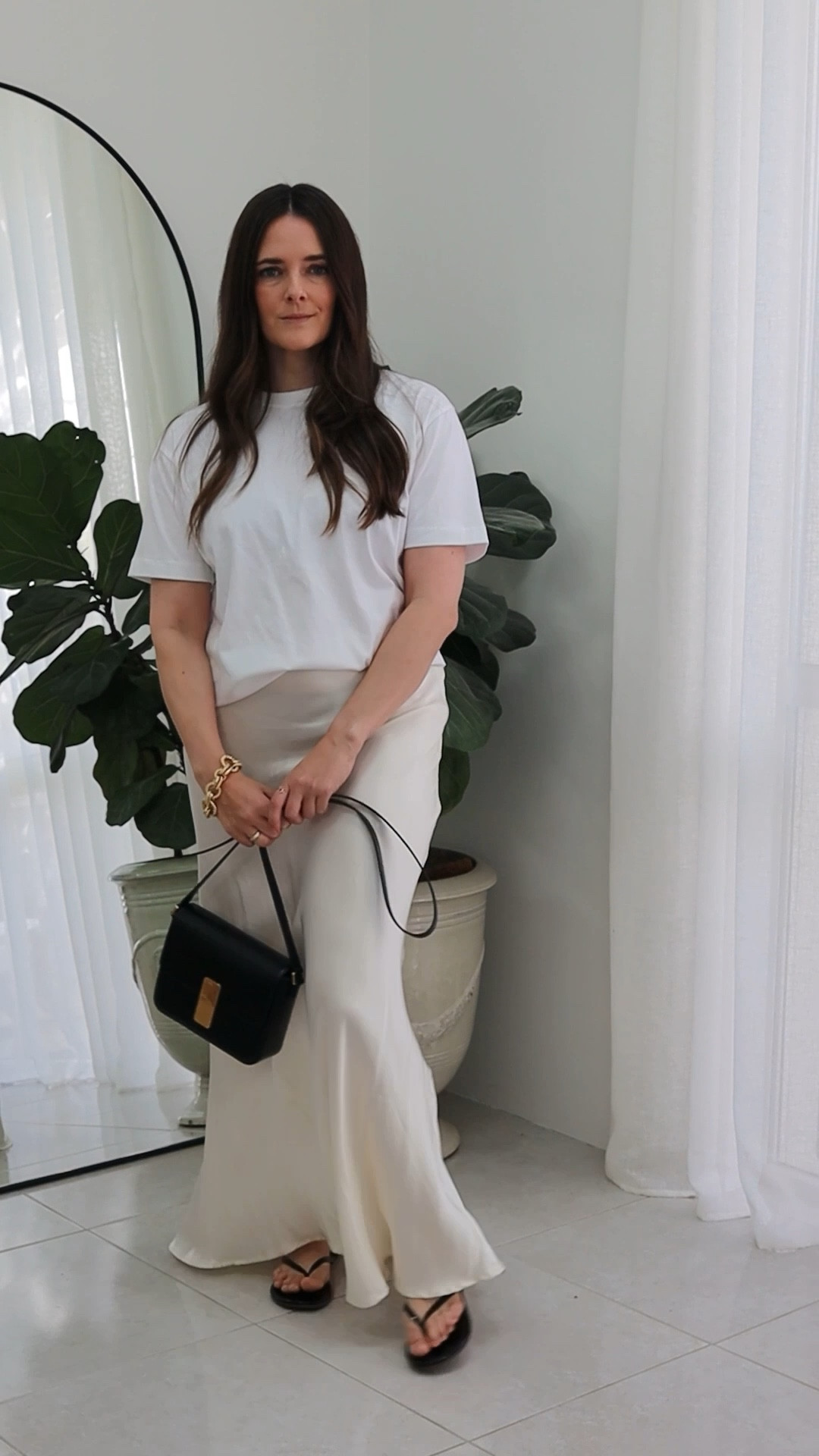 Simple tee and long satin maxi skirt outfit idea. Just add sandals and a chic black bag. Style it up with beautiful gold jewellery. 

#LTKaustralia #LTKstyletip #LTKspring