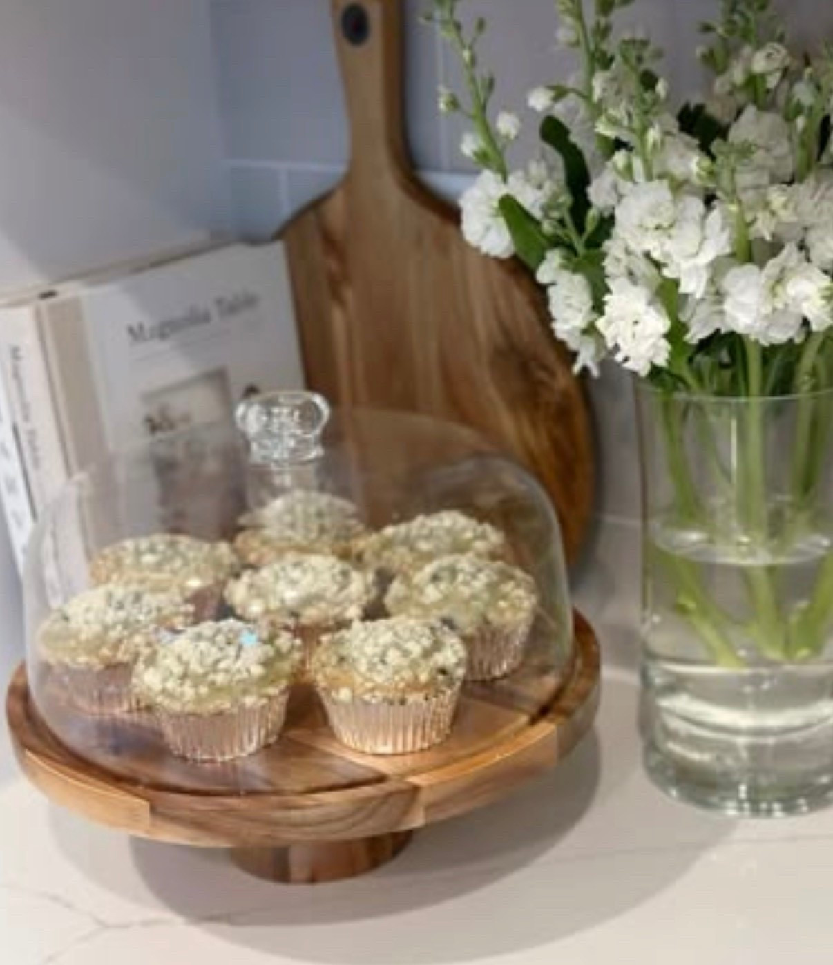 Effortless kitchen counter spring styling with my favorite covered cake stand, fresh flowers, and a few cookbooks. The perfect combo for any small kitchen corner that you want to elevate for spring. 

#LTKSeasonal #LTKfoodie #LTKHome