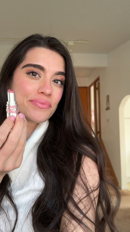 Ysl loveshine lip oil stick 
Hybrid of a lipstick , lipgloss & a tinted lip balm. Glide’s on so smoothly. 
shade shown is #44 
It’s a pretty pink nude.
 Great Mother’s Day gift idea 