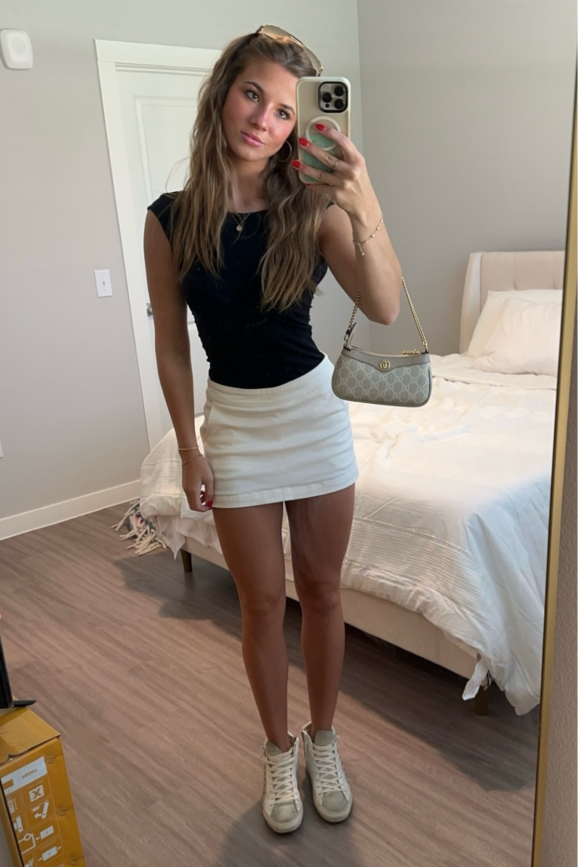 basic outfit black backless top white skirt and high tops with sunglasses and little handbag . 


#LTKBacktoSchool #LTKShoeCrush #LTKWorkwear