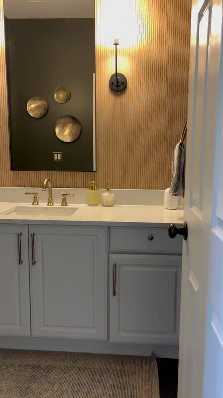 🌟 Trend Alert 🌟 One of my favorite trends: textured walls! Textured walls and backgrounds are becoming a major trend. An easy and cost-effective way to embrace this trend is by using pole wrap for a backsplash or accent wall. In this bathroom, we elevated the style with a tall vertical mirror and two sconces instead of a traditional vanity fixture. Our installer brilliantly brought my vision to life. 

Would you do this to a space in your home?! 





#LTKsalealert #LTKhome #LTKstyletip