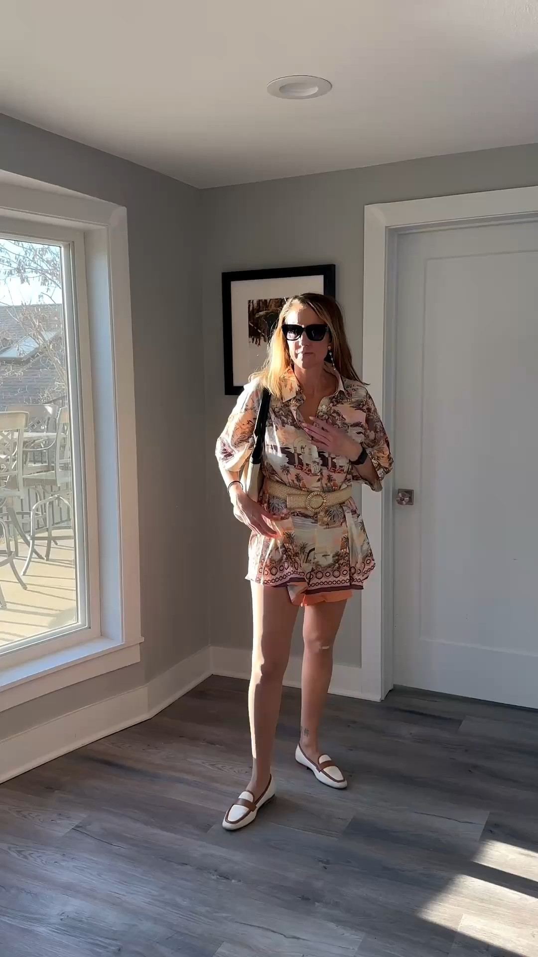 This look is the ultimate vacation-ready ensemble, blending a tropical aesthetic with structured details for a polished finish. The scenic-print button-down and matching shorts set creates a cohesive, breezy vibe, while the wide woven belt cinches the waist to add a flattering silhouette. Paired with classic two-tone loafers and sleek sunglasses, the outfit transitions perfectly from a morning exploring the city to a seaside lunch.

Vacation mode is officially activated in this matching set. 🌊 I love how the two-tone loafers ground the playful print for a more sophisticated feel. Tap to shop my summer favorites! 🛍️

matching set, tropical print, scenic print, woven belt, straw belt, two-tone loafers, white loafers, summer outfit, vacation style, resort wear, belted shirt, button down shirt, sunglasses, casual chic, spring fashion, printed shorts, effortless style, travel outfit, accessories, apparel

#LTKgrwm #LTKSpringSale #LTKdayinmylife

#LTKmomlife #LTKootd #LTKdayinmylife