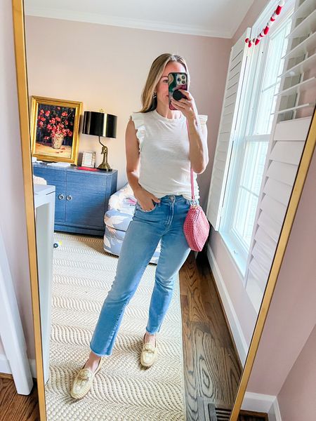 This white ruffle tank by Z Supply gets worn on REPEAT! I have an XS, and it’s so easy to wash and dry. I’ve paired it with MOTHER jean sin a 25 (TTS) and a Clare V Crossbody bag. These shoes are Sam Edelman Rattan Loafers. #springstyle 

#LTKunder100 #LTKSeasonal #LTKshoecrush