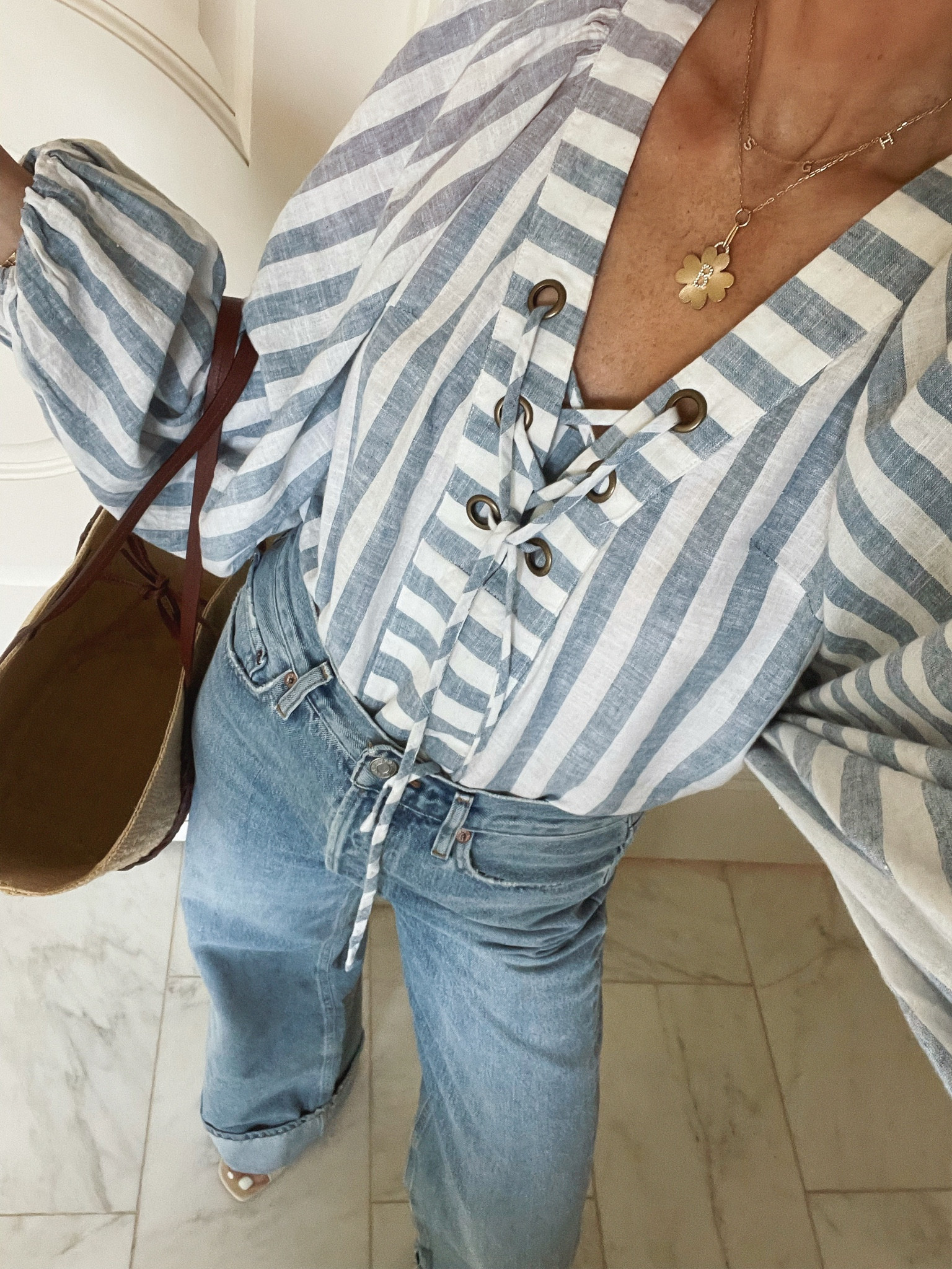 Stripe blouse from Anthropologie. Love this for memorial day weekend and 4th of July. Fits tts I'm wearing size small