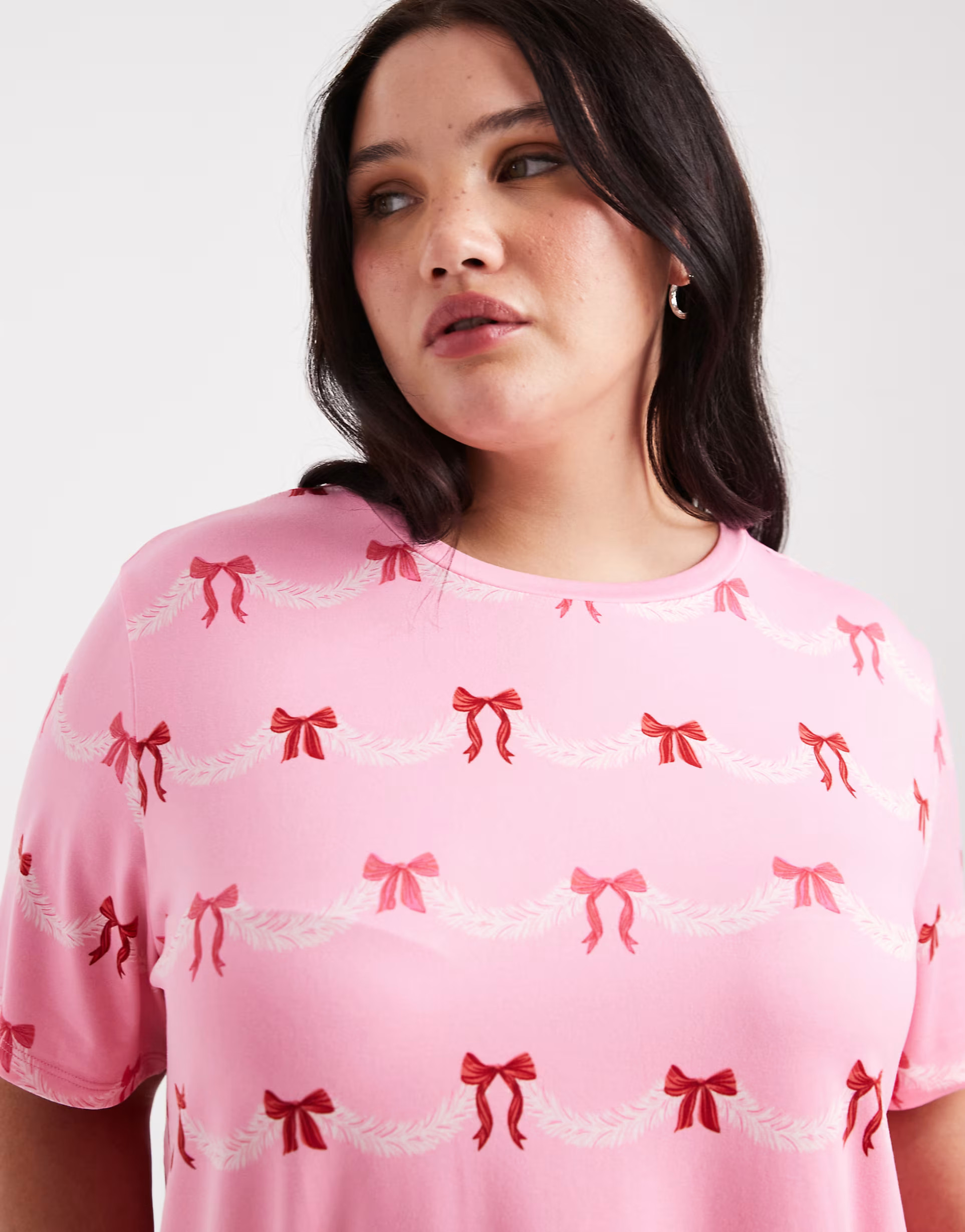 Urban Threads Curve Christmas short sleeve revere and pants pajama set in festive bow print | ASOS (Global)