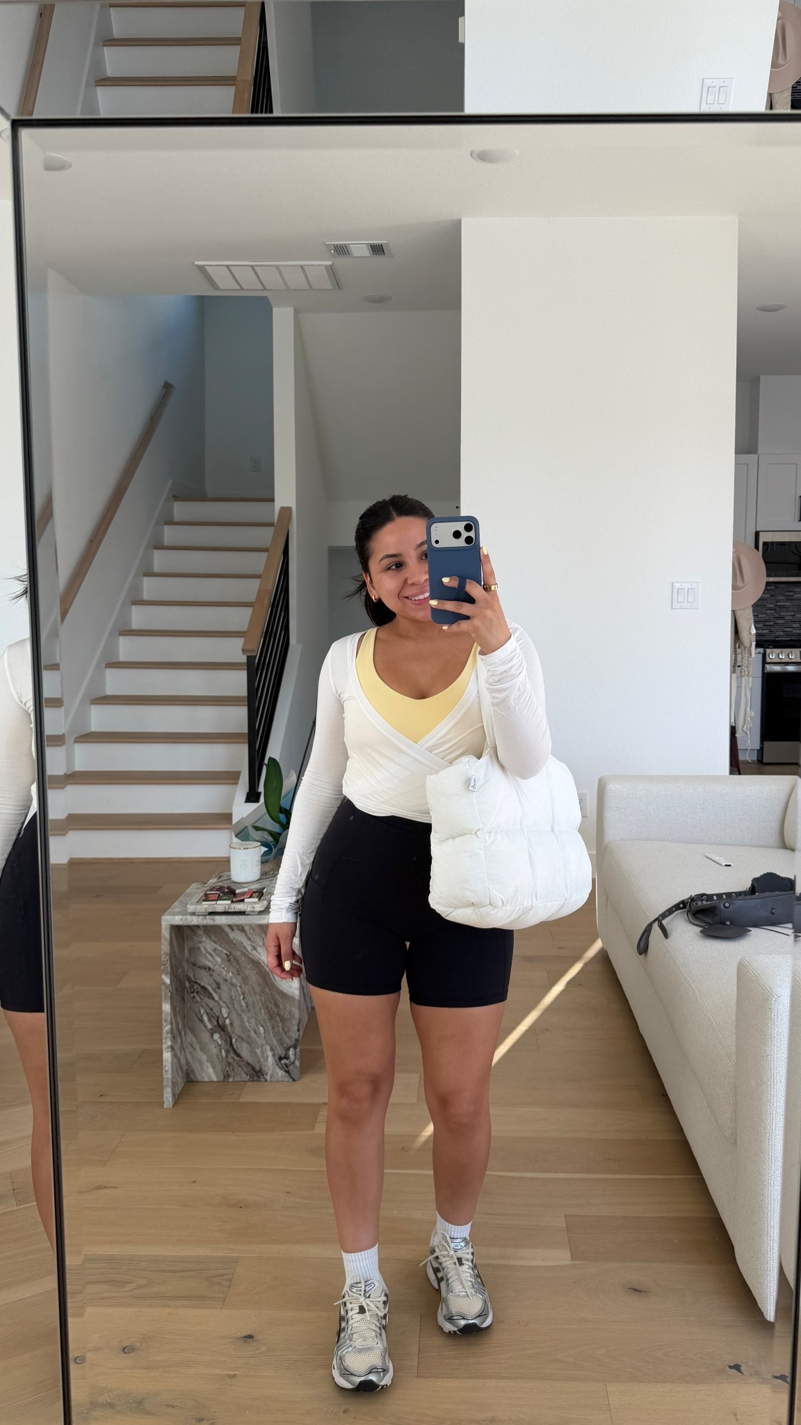 Biker shorts: small
Yellow sports tank: small
Wrap top: small
White socks 
Sneakers: 6.5 women 
Puffer tote bag 

#LTKgrwm #LTKActive #LTKootd