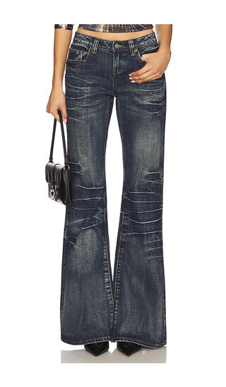 Extreme Blue Wash Flare Jeans in Dark Denim | Revolve Clothing (Global)