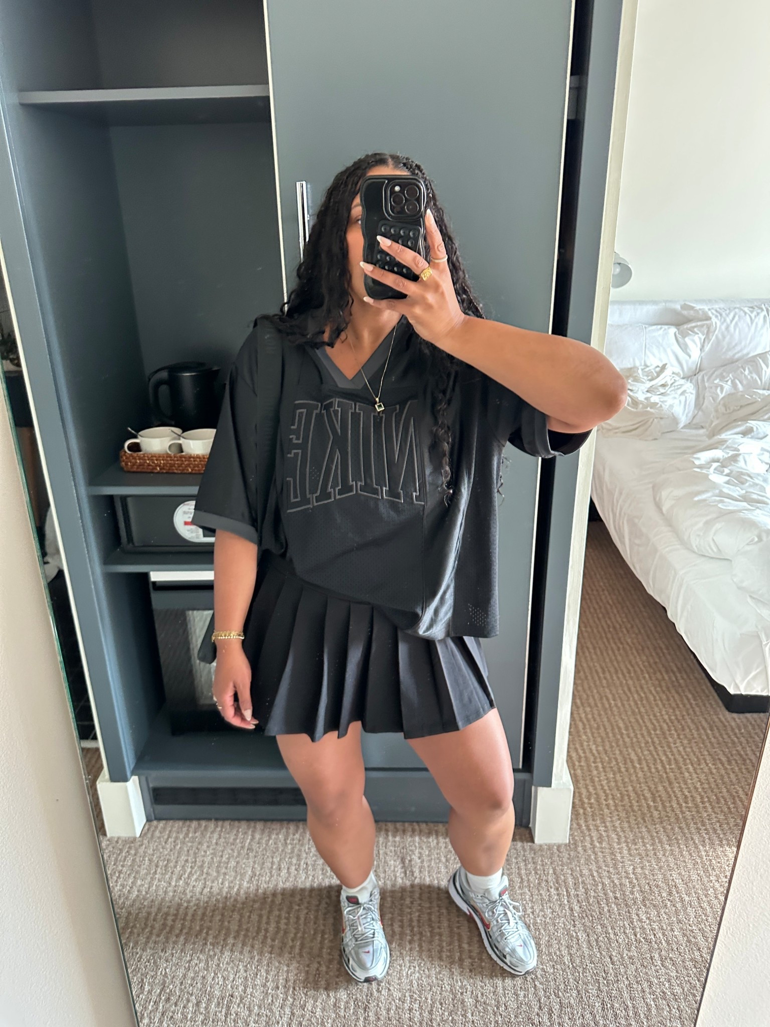 Cute all black outfit, with a oversized nike jersey and a pleated skirt! 

#LTKSeasonal #LTKMidsize #LTKStyleTip