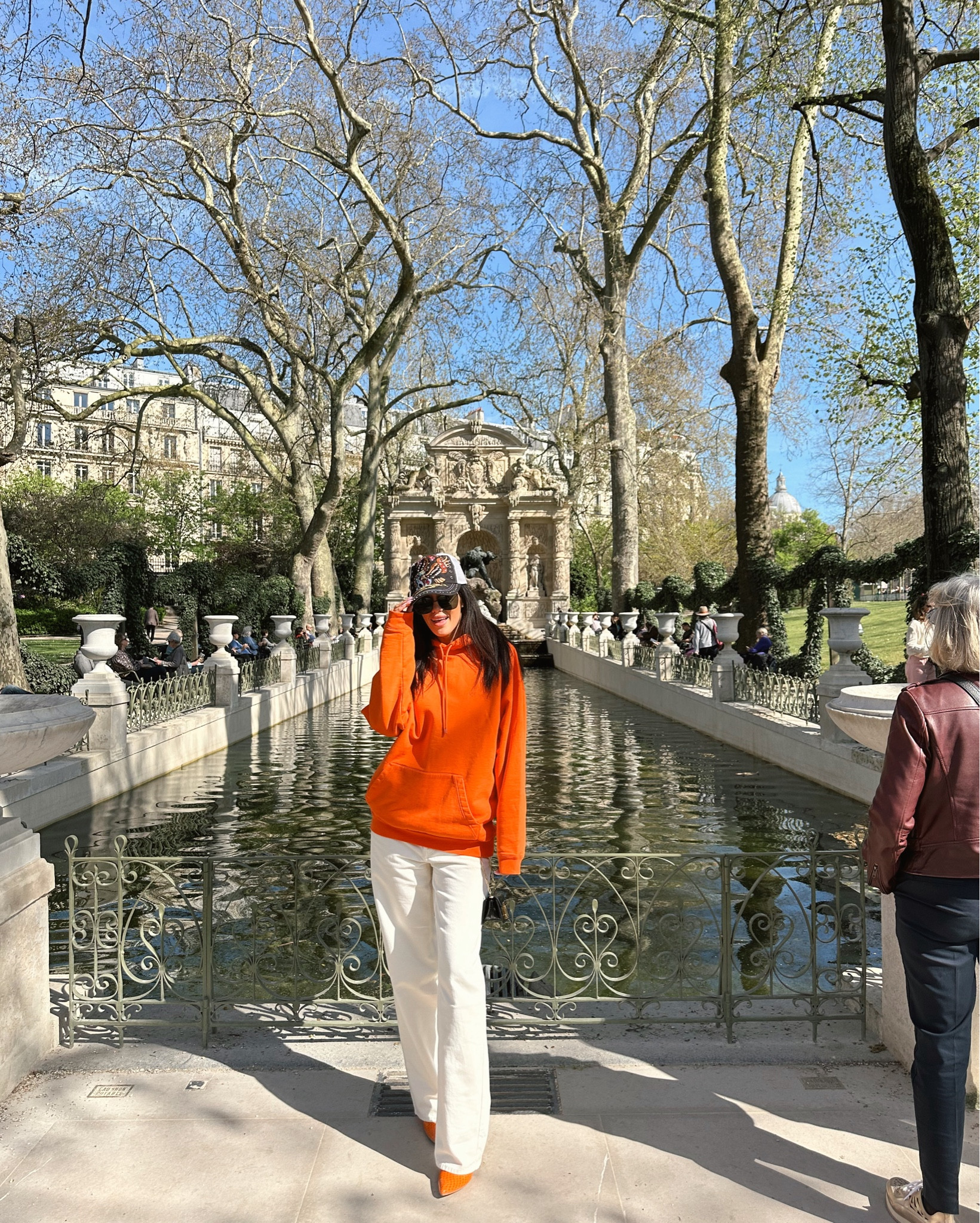 Paris in spring! I love this oversized hoodie with the Ed Hardy hat. I think it’s so fun! Couldn’t find a match for my mini Tom Ford purse, but I will keep a lookout and update this post if I find one 

Oversized orange hoodie, Bright orange sweatshirt, Street style hoodie, Casual oversized hoodie, White wide leg jeans, Relaxed fit denim, Baggy white pants, Trucker hat with embroidery, Y2K trucker hat, Statement trucker hat, Orange heeled boots, orange boots outfit, colorful boots, paris outfit, Casual weekend outfit, Europe outfit 2025, Sporty street style look, Fashion blogger outfit, casual outfit, maximalist city outfit, streetwear aesthetic, Cool girl off-duty outfit, beige aesthetic, off white jeans, cream jeans, off white denim, cream denim, eggshell jeans, Color blocking outfit idea, Relaxed oversized layers, Trendy comfortable outfit, Spring casual fashion, Elevated basics look, black mini bag, black belt bag

#LTKFindsUnder100 #LTKStyleTip #LTKTravel