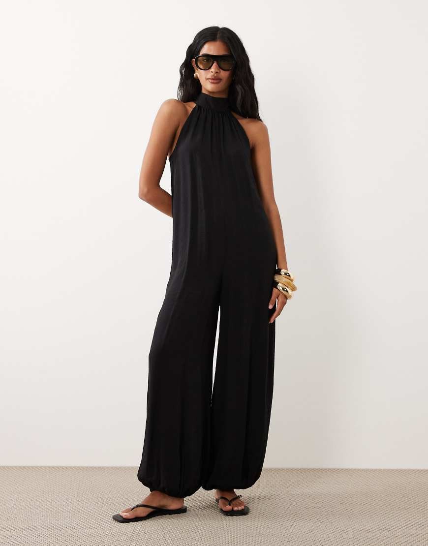 ASOS DESIGN halter neck jumpsuit with tie detail in black | ASOS (Global)