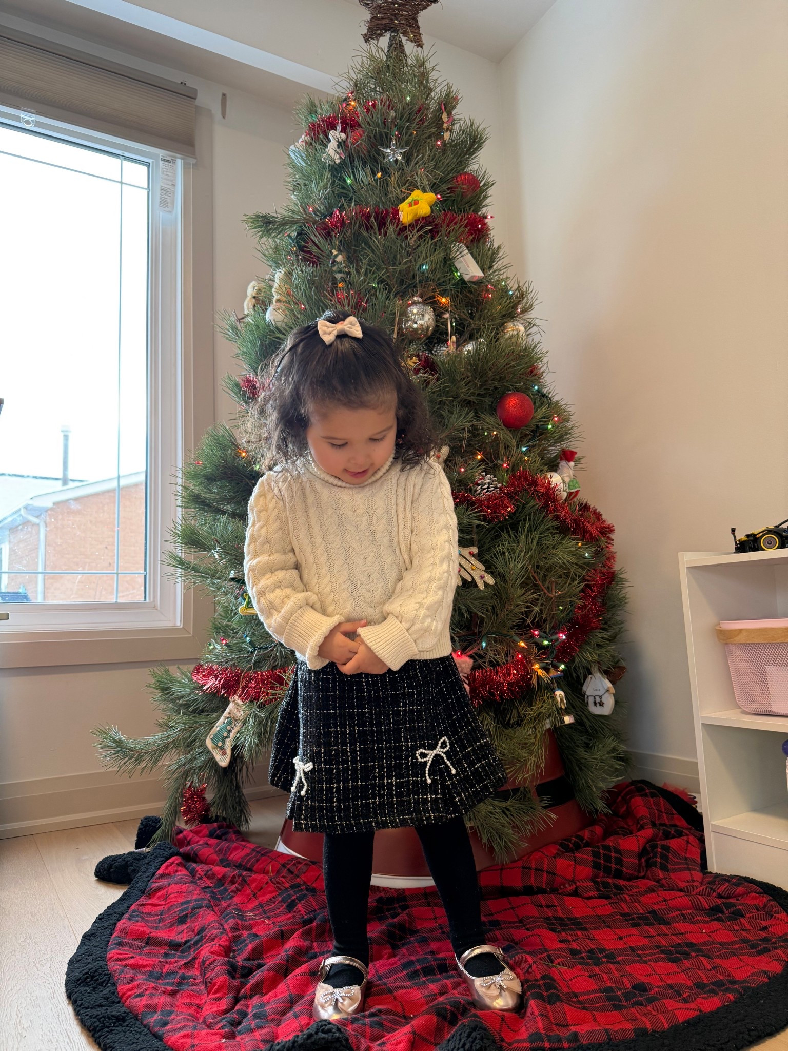 My 3 year old daughter’s beautiful outfit for her winter concert today! It’s by Cupcakes & Cashmere and you can find it at Marshall’s and Winners. Even though she’s 3 years old this outfit is a 4T and if she raises her arms her belly would show so I would definitely go up a size! The outfit also came with gloves and a hat with beaded pearl bows on them. She got so many compliments for this outfit, especially the black skirt with pearl beaded bows on it, and her little slippers with the beaded bows on it too! She keeps asking to wear these slippers even around the house haha she’s obsessed with these holiday shoes. 

#LTKwinter #LTKholiday #LTKkids