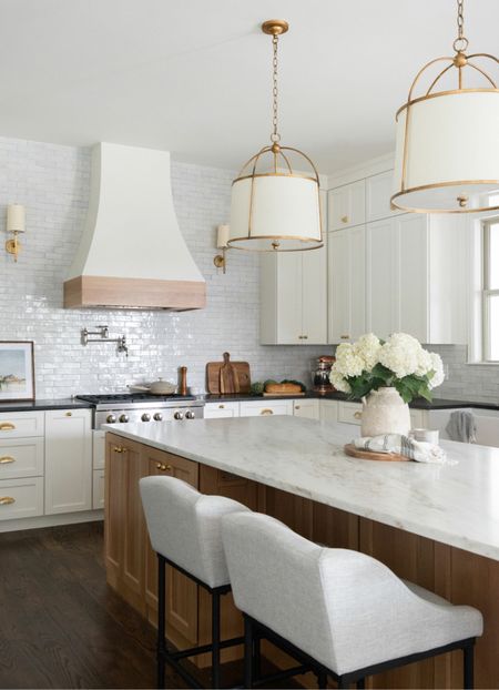 These counter stools were one of our very best purchases. So comfortable and spot clean like a dream. We sprayed the base matte black but the silver is pretty, too. #LTKxWayDay 