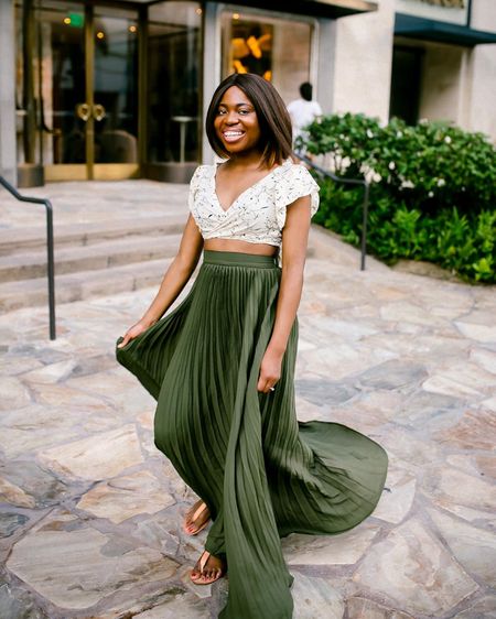 Pleated maxi skirts can be your festive AND vacation go-to - perfect for everything from casual dinners to glamorous parties. My exact skirt is sold out but I’ve added some top alternatives! #Holiday2023

#LTKHoliday #LTKfindsunder50 #LTKSeasonal