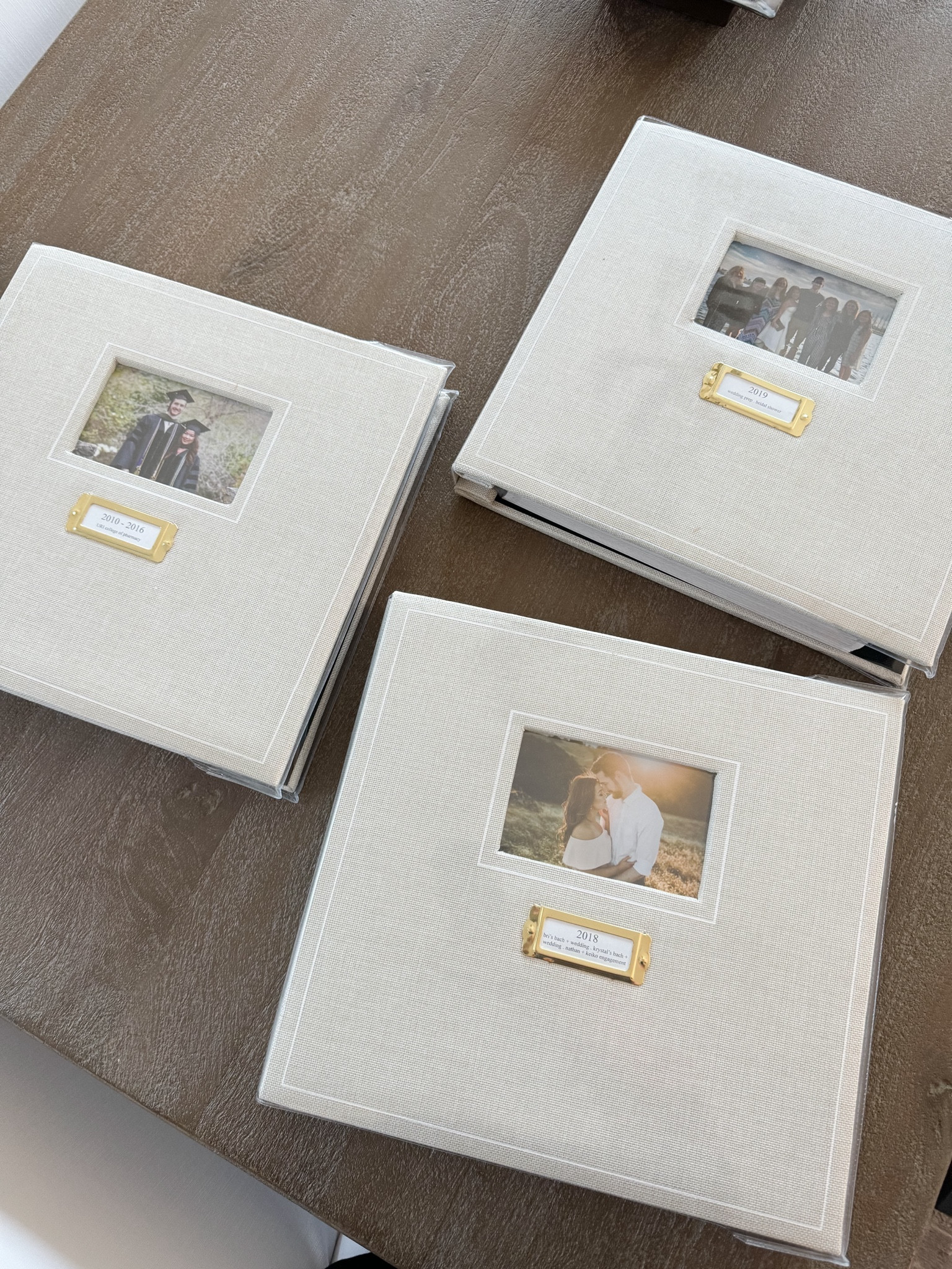 Years ago we decided that we want to be a family that keeps hard copy photo albums and I'm so happy we did! We have so much fun flipping back through these memories. Looking at photos on the computer just isn't the same. Love these photo albums we found at Michaels! Bought a bunch of these in bulk so that we have the same albums as we document the years to come. I really like the label detail on the cover - I list the year of the photos and underneath that I list the main events in that album (bridal shower, engagement photos, etc) 

#LTKFamily #LTKKids #LTKHome