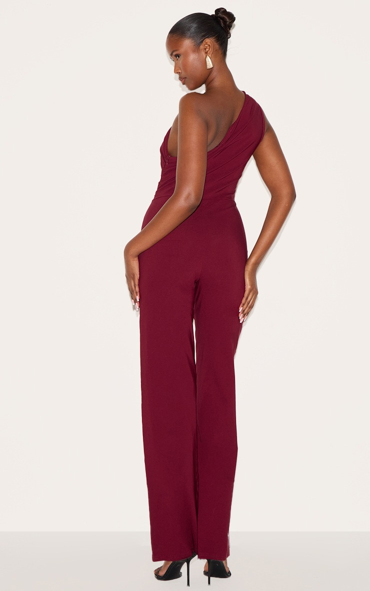 Wine Stretch Woven One Shoulder Ruched Flared Jumpsuit | PrettyLittleThing US