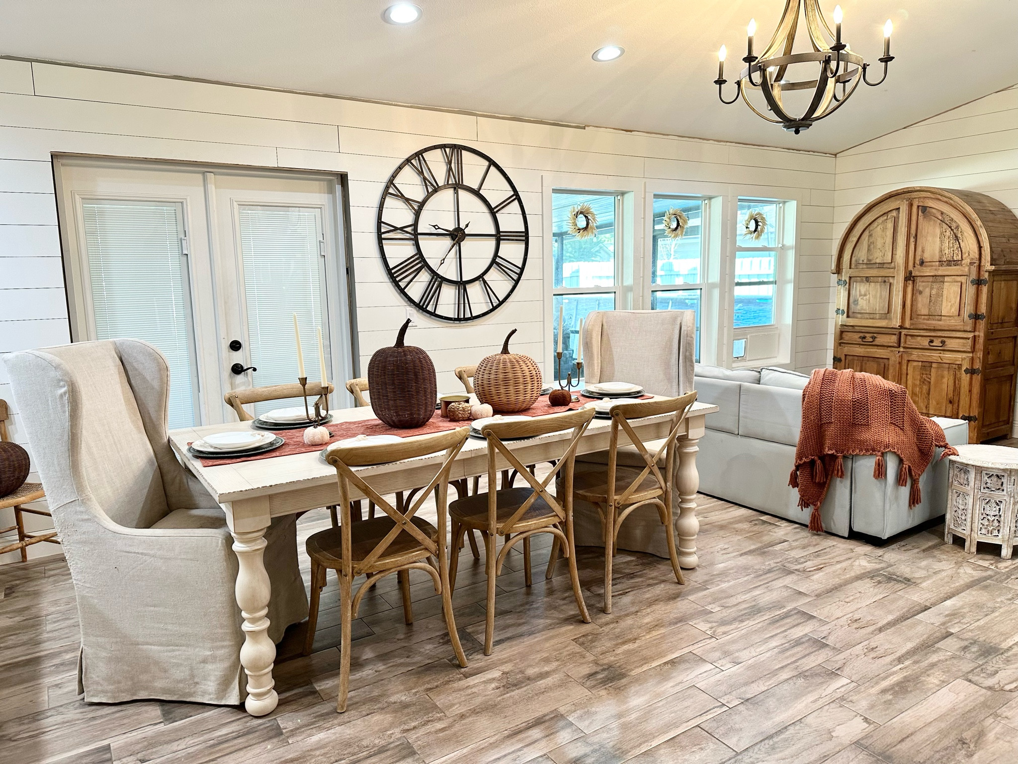 My simple fall dining room, neutral fall dining room decor, fall decorations, wicker pumpkins, rust throw blanket, large metal wall clock, farmhouse dining room fall look. 

#LTKstyletip #LTKhome #LTKSeasonal