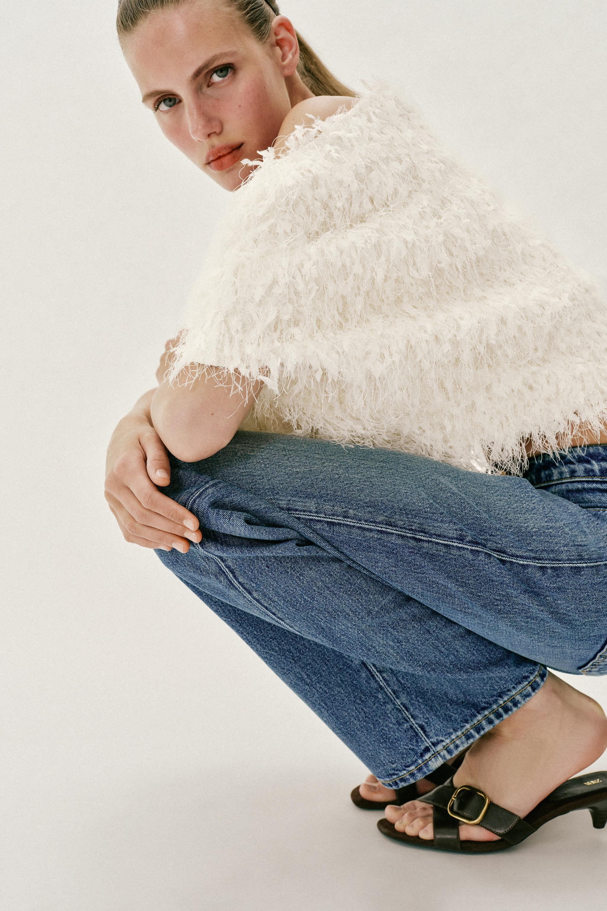 Top with fringe, boat neck, and short sleeves. | Zara US