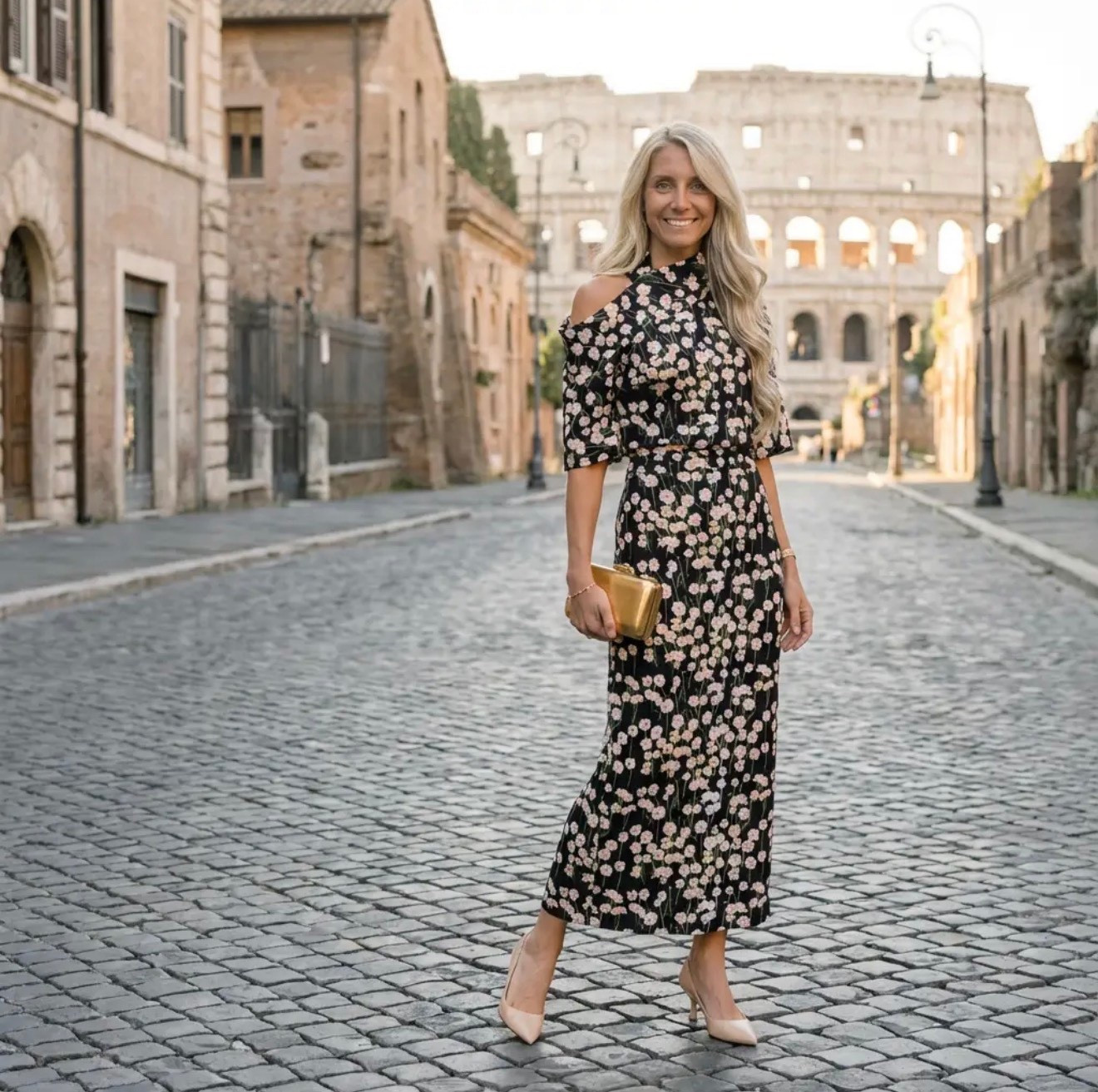 A stylish woman with long, softly waved blonde hair stands confidently on a quiet cobblestone street in Rome at golden hour, with the Colosseum rising elegantly in the background. She wears a black floral midi dress with a delicate off-the-shoulder detail, cinched at the waist for a feminine silhouette. Neutral pointed-toe heels elongate her frame, and she carries a small gold clutch that catches the warm light. The historic stone buildings, vintage street lamps, and empty European street create a romantic, cinematic atmosphere. The mood is confident, elegant, and effortlessly chic — an Emily in Paris aesthetic with Italian romance, timeless femininity, and quiet luxury undertones. Shot in editorial fashion photography style, soft natural lighting, shallow depth of field, Vogue-inspired composition, cinematic realism.

⸻

HASHTAGS

#EmilyInParis
#EmilyInParisVibes
#EuropeanChic
#ParisianStyle
#RomanHoliday
#ItalianAesthetic
#OldMoneyVibes
#QuietLuxury
#EffortlessElegance
#FeminineStyle
#ChicAbroad
#TravelStyle
#FashionInspo
#RomanticStyle
#WanderlustFashion
#TimelessElegance
#LuxuryAesthetic
#OOTDEurope
#EditorialStyle
#MainCharacterEnergy
#ClassicWithATwist
#EuropeanSummer
#StyleInspoDaily
#WomenWithStyle
#TrendyWithAPassport

#LTKGiftGuide #LTKHoliday #LTKdayinmylife