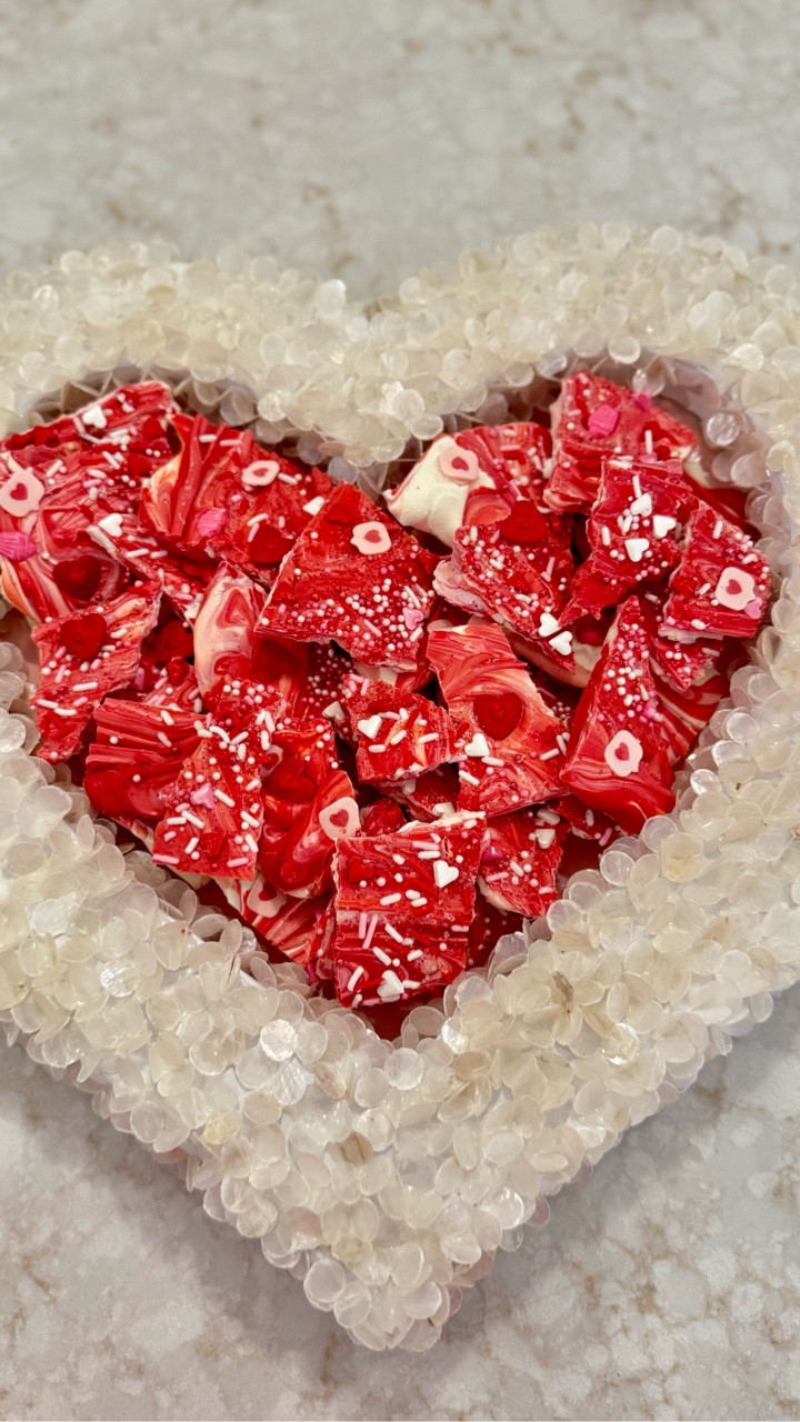 This DIY Valentine chocolate bark is such an easy and festive treat! Made with swirled chocolate, fun sprinkles, and broken into shareable pieces, it’s perfect for gifting, dessert boards, or a sweet Valentine’s snack. Simple to make, pretty to display, and always a crowd favorite.

LTK Hashtags (paragraph format):
#LTKValentines #LTKDIY #ValentineTreats #ChocolateBark #DIYDesserts #HomemadeSweets #EasyEntertaining #JustJennsDesign

#LTKHome #LTKSeasonal