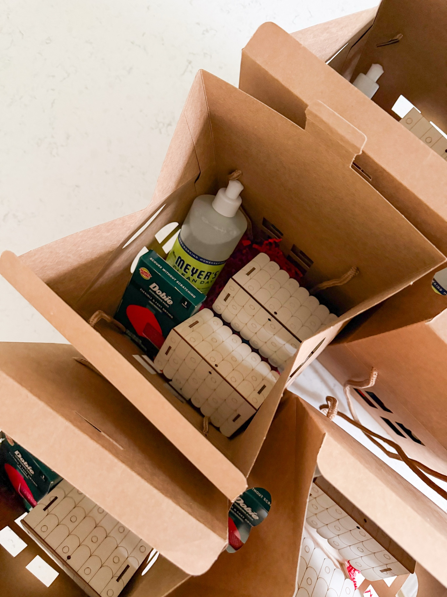 NEIGHBOR GIFT IDEA! 🎁 Wooden gingerbread house craft + dish soap + holiday sponge = a festive bundle that’s cute and practical for the whole family! Also how adorable are these gingerbread house gift boxes?! 

#LTKHoliday #LTKHome #LTKGiftGuide