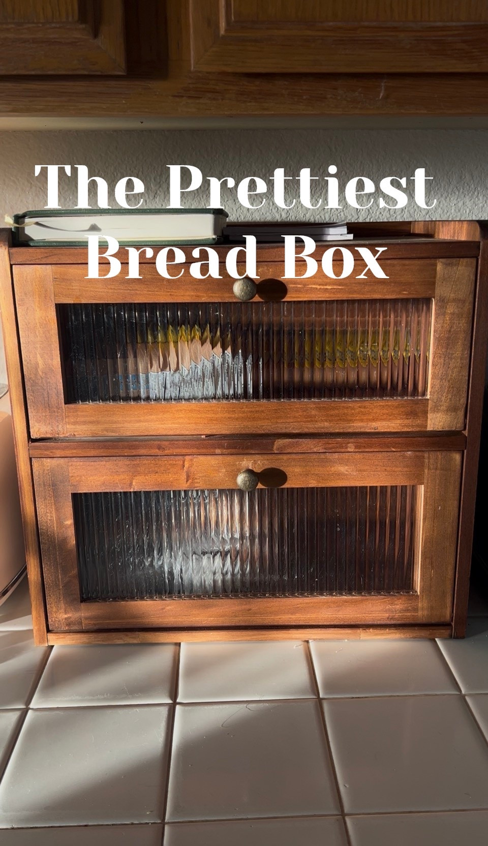 This is the prettiest bread box I’ve ever seen. It’s perfect for my gluten-free bread on top and my husband’s bread on the bottom. It’s a beautiful walnut color with ribbed glass detailing. It adds that vintage touch I love!