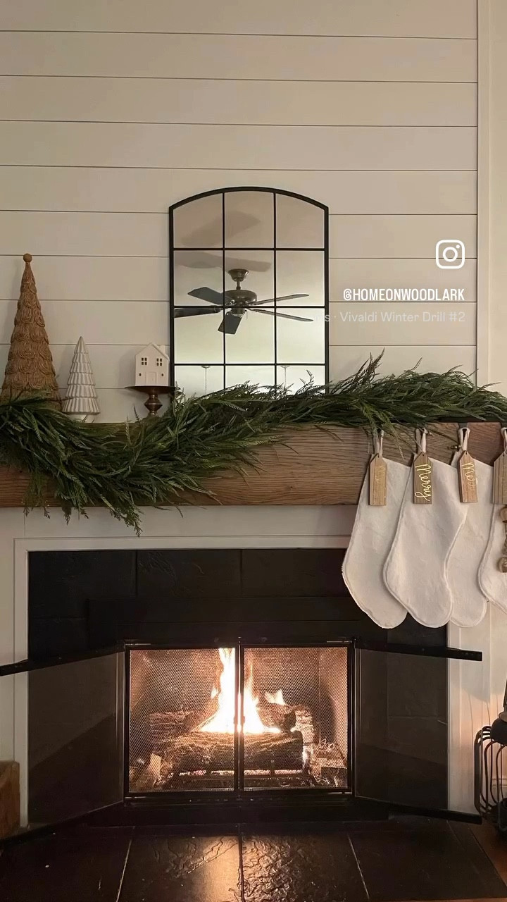 My Christmas fireplace mantel this season is filled with trees, whimsical garland, spruce garland, white stockings and gold bells.  

Attach it with toggle command hooks!  

Christmas decor.  Family room.  Fireplace decor.  Garland.  

#LTKHome #LTKHoliday #LTKWatchNow
