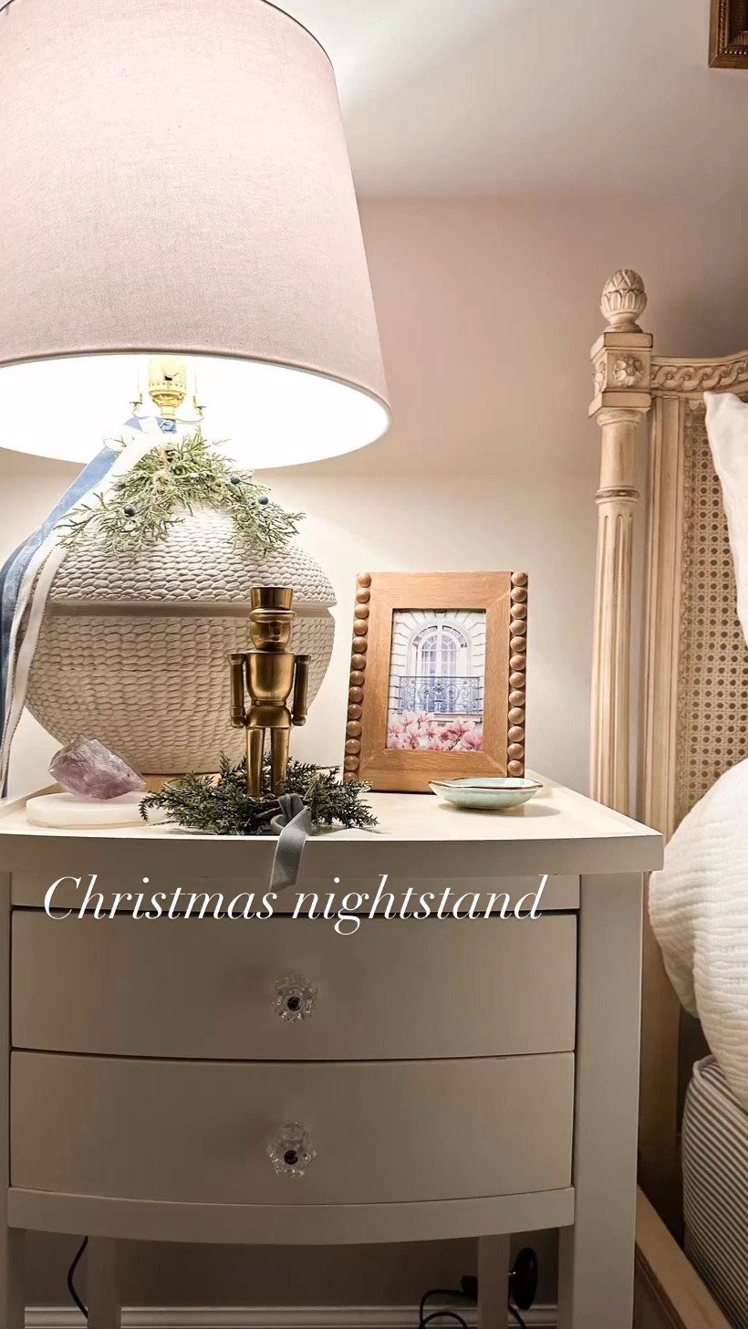 Caption:
Even the smallest details can bring big holiday cheer! 🎄✨ This Christmas, we added a simple nutcracker, a petite wreath, and a touch of ribbon to the nightstand for a festive yet elegant look.

These subtle touches make your bedroom feel cozy and magical, creating a retreat that’s perfect for the season. 🌟 How do you style your nightstand for the holidays? Let us know in the comments! 👇

#HolidayNightstand #ChristmasDetails #CozyCharm #FestiveTouches #EHStyleSnippets

#LTKSeasonal #LTKHoliday #LTKHome