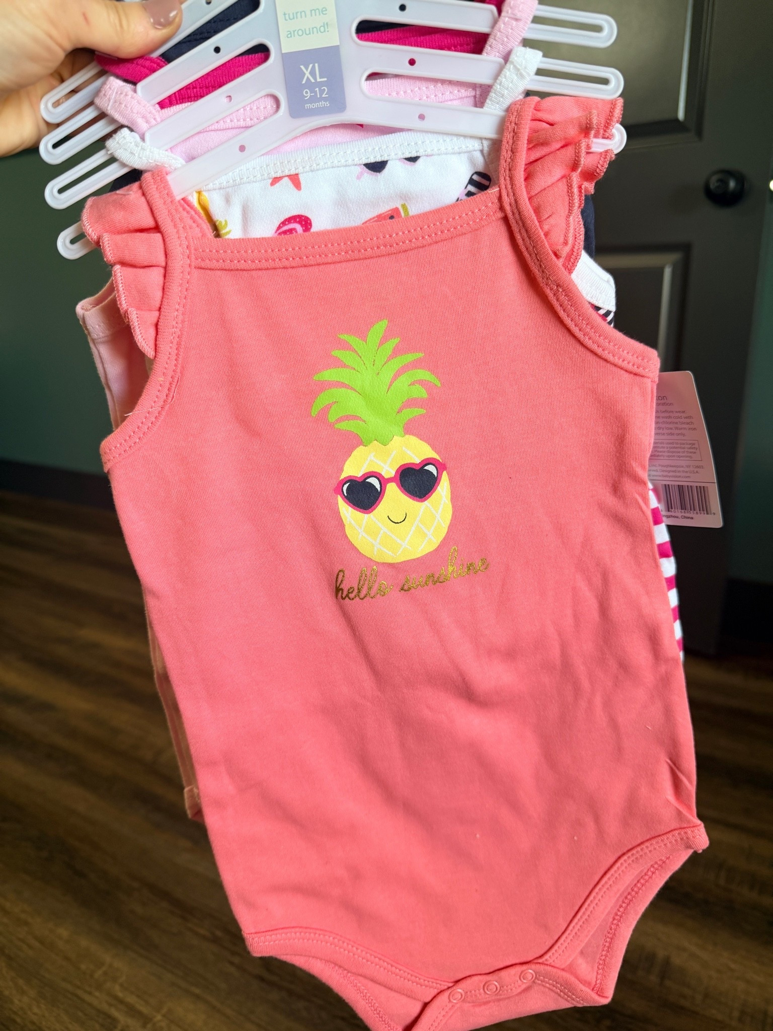 The perfect baby girl summer outfit multi-pack has arrived for warm weather! This coral pink flutter sleeve baby bodysuit features a cute tropical pineapple graphic wearing heart sunglasses with a gold "Hello Sunshine" script, making it a stellar addition to your little one's wardrobe.
If you are looking for affordable baby clothes that don't sacrifice style, this multi-pack bundle is a total win for building a budget-friendly summer baby capsule wardrobe. The set comes layered with coordinating infant girl summer clothes—including a white fruit print option and a bright pink striped bodysuit, giving you multiple mix-and-match options for one low price.
Made from ultra-soft, breathable cotton fabric, these sleeveless baby bodysuits are perfect for:
☀️ Hot summer days & backyard play
🏖️ Tropical family vacations & beach trips
🍍 Everyday summer baby style & easy diaper changes
Whether you're shopping for a baby shower gift, updating your baby essentials, or hunting for the best baby finds and boutique styles on a budget, this set is a must-have!


baby girl summer outfits, coral pink baby bodysuit, tropical baby clothes, pineapple baby outfit, flutter sleeve infant bodysuits, baby girl multi-pack clothes, affordable baby boutique, toddler summer fashion, hello sunshine baby clothes, budget-friendly baby finds. 

 #LTKSeasonal #LTKBaby #LTKKids